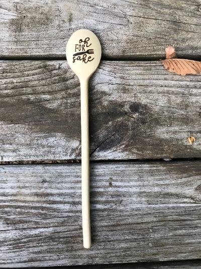 A funny wood burned cooking spoon.  Has a wood burned design on the bowl of the spoon that says "oh for fork sake".  A fun kitchen gift.