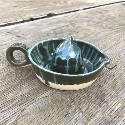 Green Pottery Citrus Juicer.  Squeeze fresh juices from the pointed/ridged top then pour juices out of spout with easy grip handle.  Hand thrown on potter's wheel.