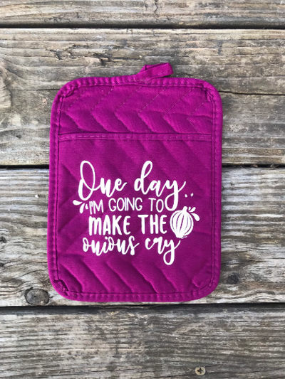 This purple pocket potholder has a white vinyl design that says "One day I'm going to make the onions cry" that would make an excellent kitchen gift for those who like to cook or bake.