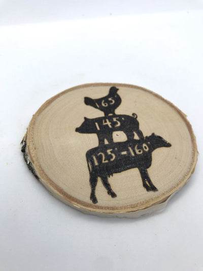 Useful Kitchen Magnet.  Has a cow at the bottom, pig standing on top of the cow, and the chicken on top of the pig.  Each animal has their cooking temperatures.