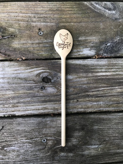 Fun Kitchen Cooking Spoon.  Wood Kitchen Spoon with Wood Burned designs.  Design has a chicken and a quote "eggcelent at wingin' it" on the bowl part of the spoon.  The handle can have a personalization for free.