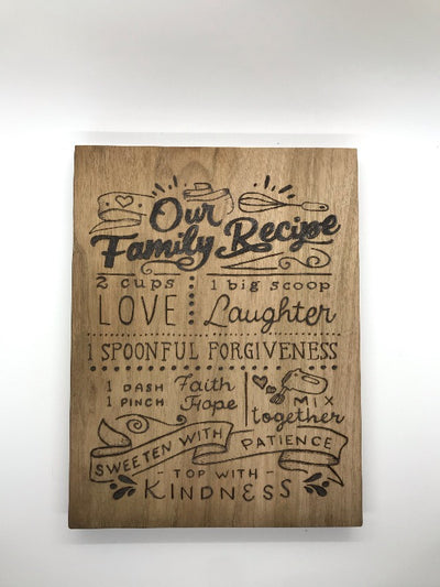 Wood Burned Kitchen Sign:  Our Family Recipe.  Has 2 cups love, 1 big scoop laughter, 1 spoonful forgiveness, 1 dash faith, 1 pinch hope, mix together, sweeten with patience, and top with kindness.  Unique Kitchen Gift.