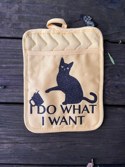 Yellow Pocket Pot Holder with funny cat design that has a cat knocking over a coffee mug with quote " I Do what I want".  Funny cat owner gift