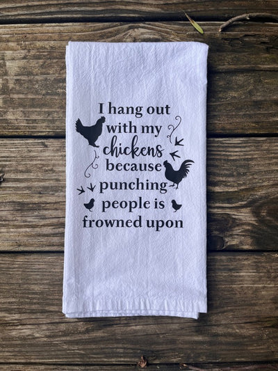 A white cotton towel with a black vinyl design that has two chickens, two baby chicks, chicken footprints, and funny quote "I hang out with my chickens because punching people is frowned upon".  A funny and useful kitchen gift for that sassy chicken lady.  Other chicken related dish towels and kitchen accessories on my Etsy shop called TheSaltyChickenGifts