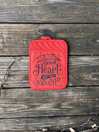 A pocket pot holder that has a vinyl design that says "I've got a good heart but this mouth...".  A useful and fun kitchen gift (can also be used as an oven mitt).