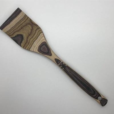 Light and Dark Brown Colored Wooden Cooking Spatula.  Made with food coloring making this utensil useful and unique.