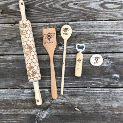 Bumblebee Kitchen Utensil Set.  Includes wooden rolling pin, wood spatula, wood spoon, wood bottle opener, and wood fridge magnet with bumblee designs wood burned by hand.  Useful Kitchen Gifts.