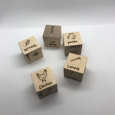 Roll the dice to see what meal you'll be cooking.  All dice have wood burned designs:  cooking method, veggies, protein, and carbs/grain.