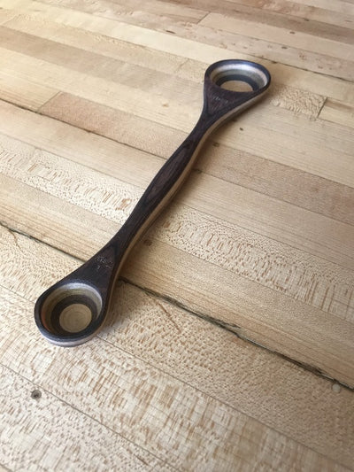 Light and Dark Brown Wood Double Sided Measuring Spoon.  One side measures a teaspoon while the other side measures a tablespoon.