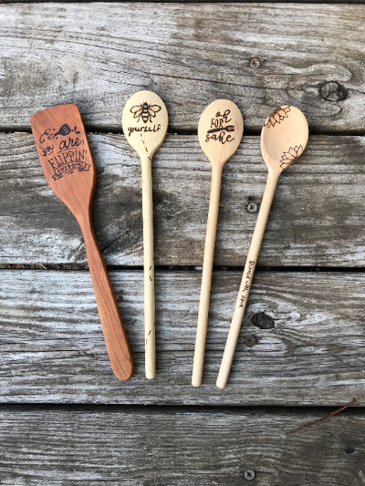 Wooden Spoon and Spatula Cooking Set.  Includes 1 spatula and 3 spoons with wood burned designs on them.